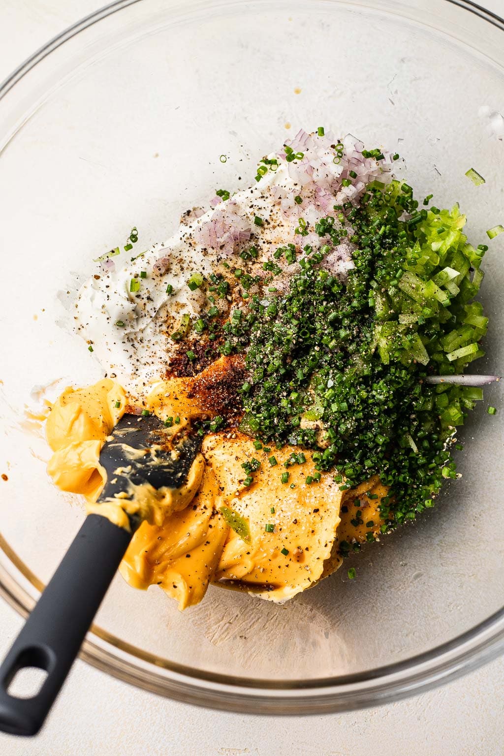 Cheese ball ingredients in a mixing bowl