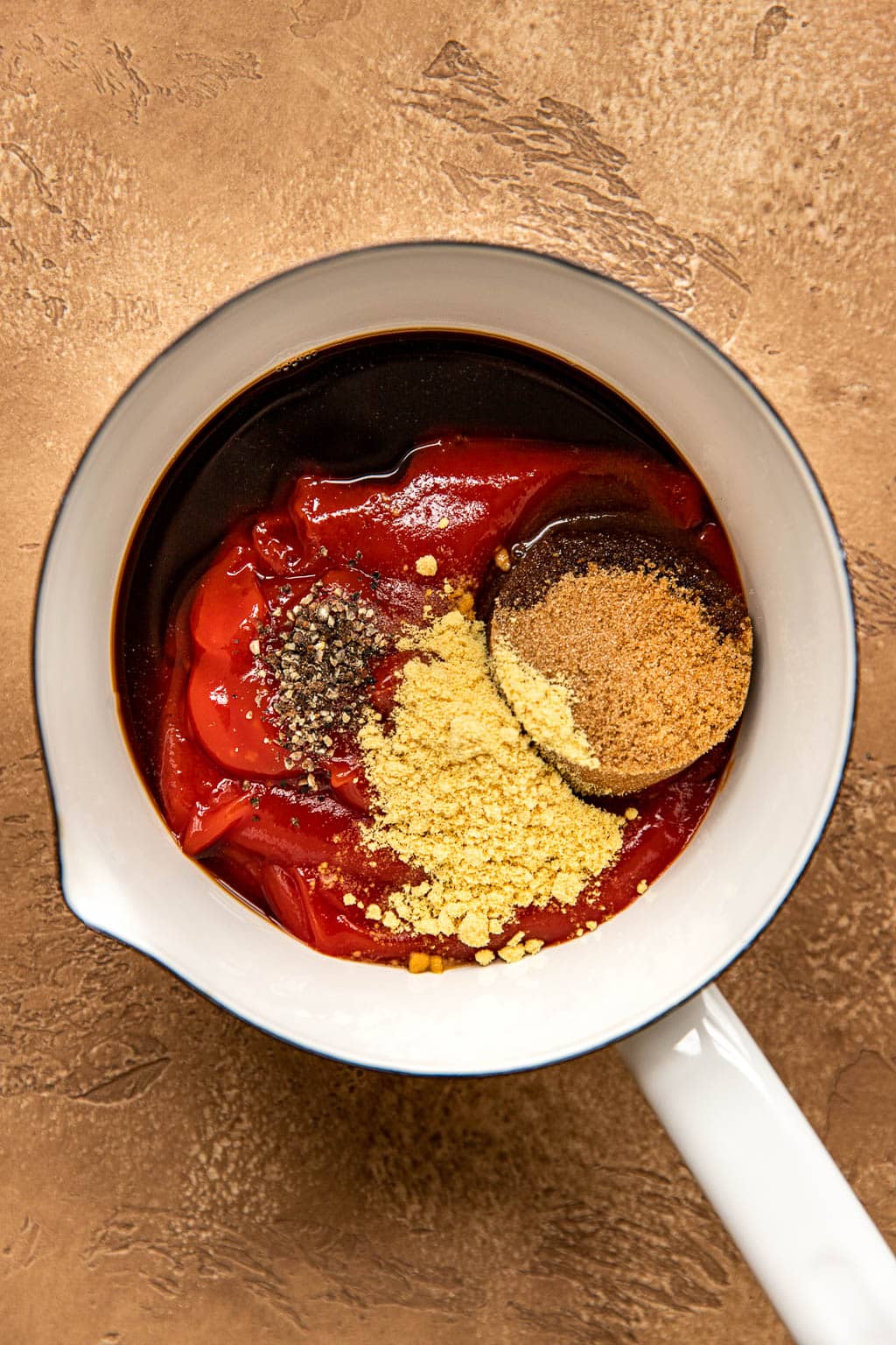 Ketchup glaze ingredients in a mixing bowl 