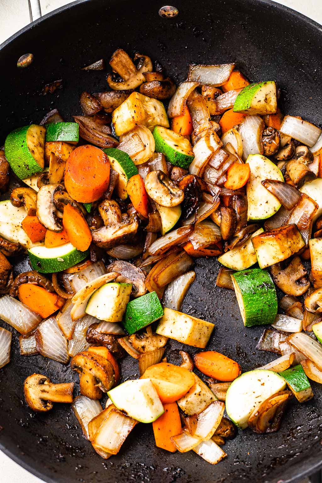 sauteed vegetables in a skillet 