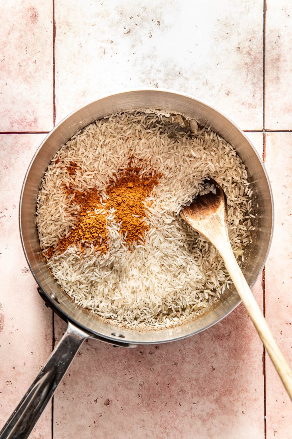yellow rice in a saucepan before cooking