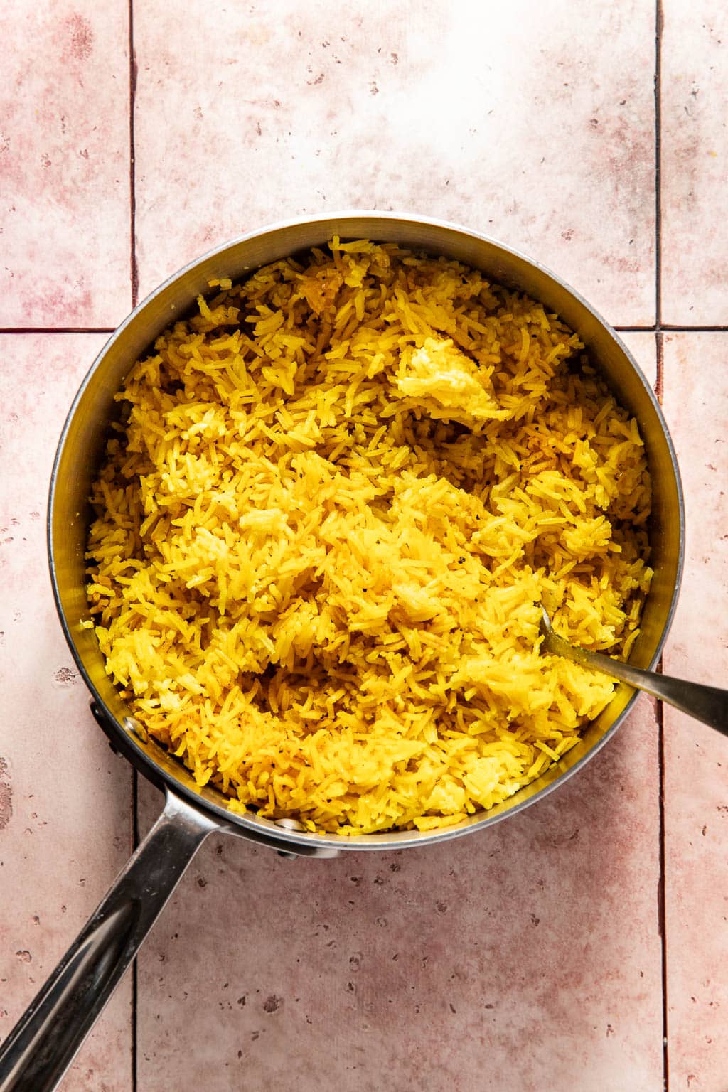 yellow rice in a saucepan after cooking