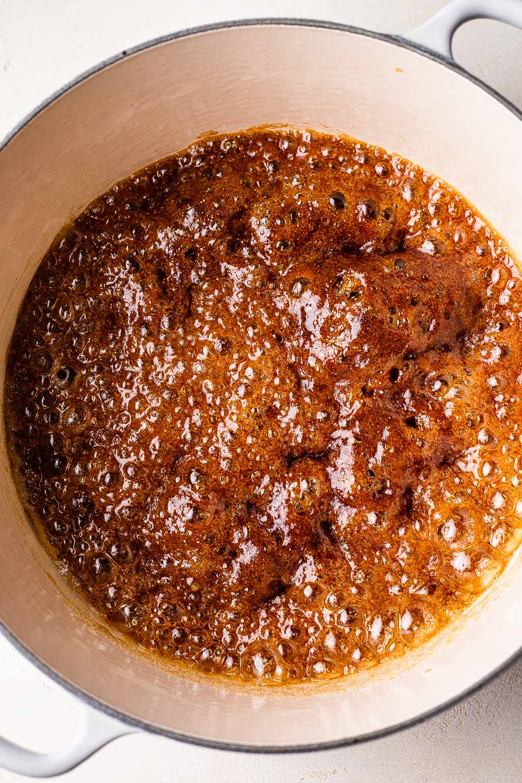 Fish sauce and brown sugar melting in a Dutch oven 