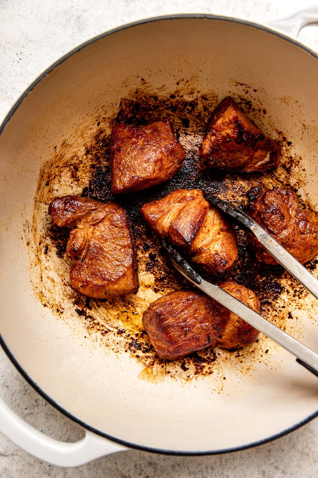 Pork butt browning in dutch oven