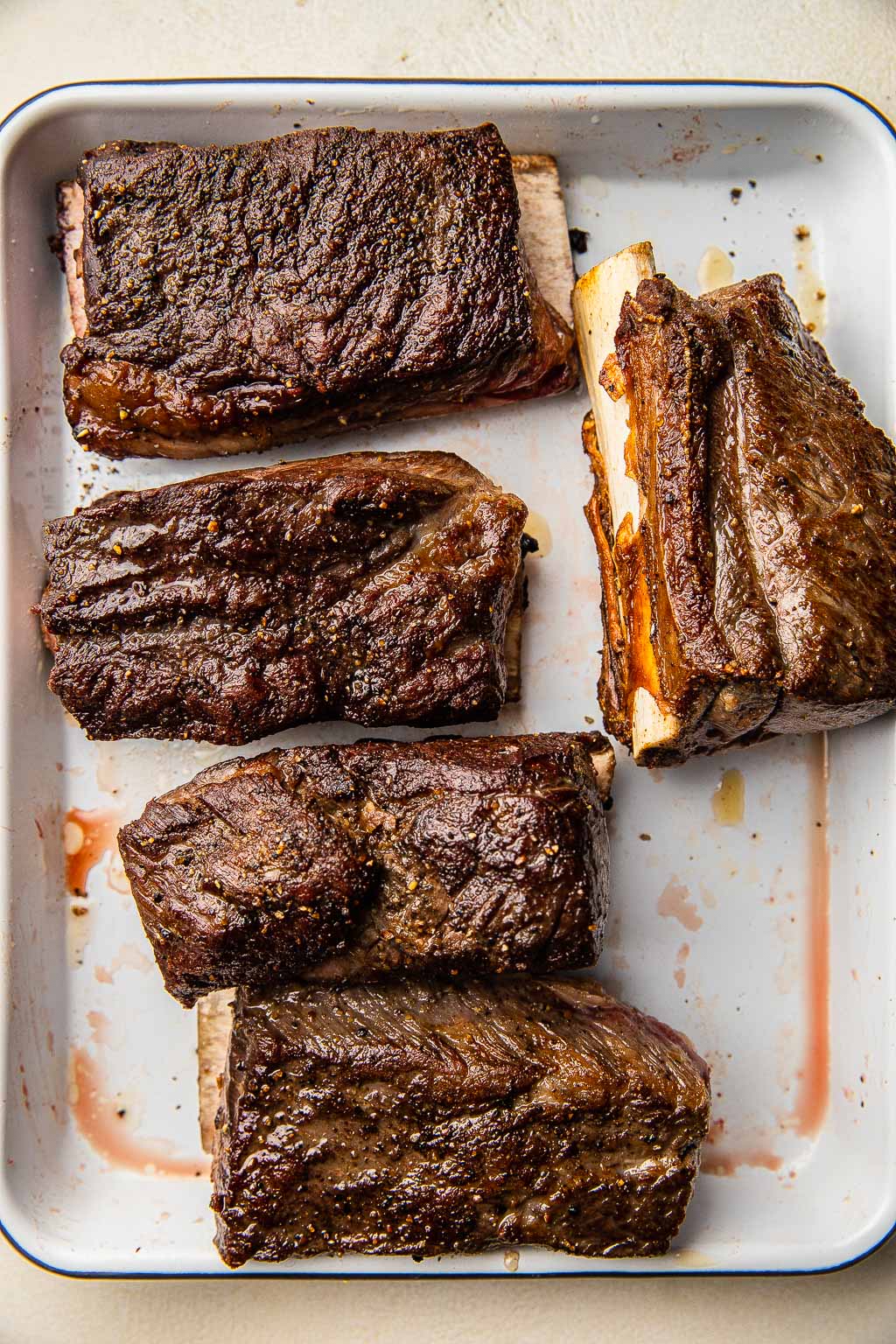 Seared short ribs on baking tray 