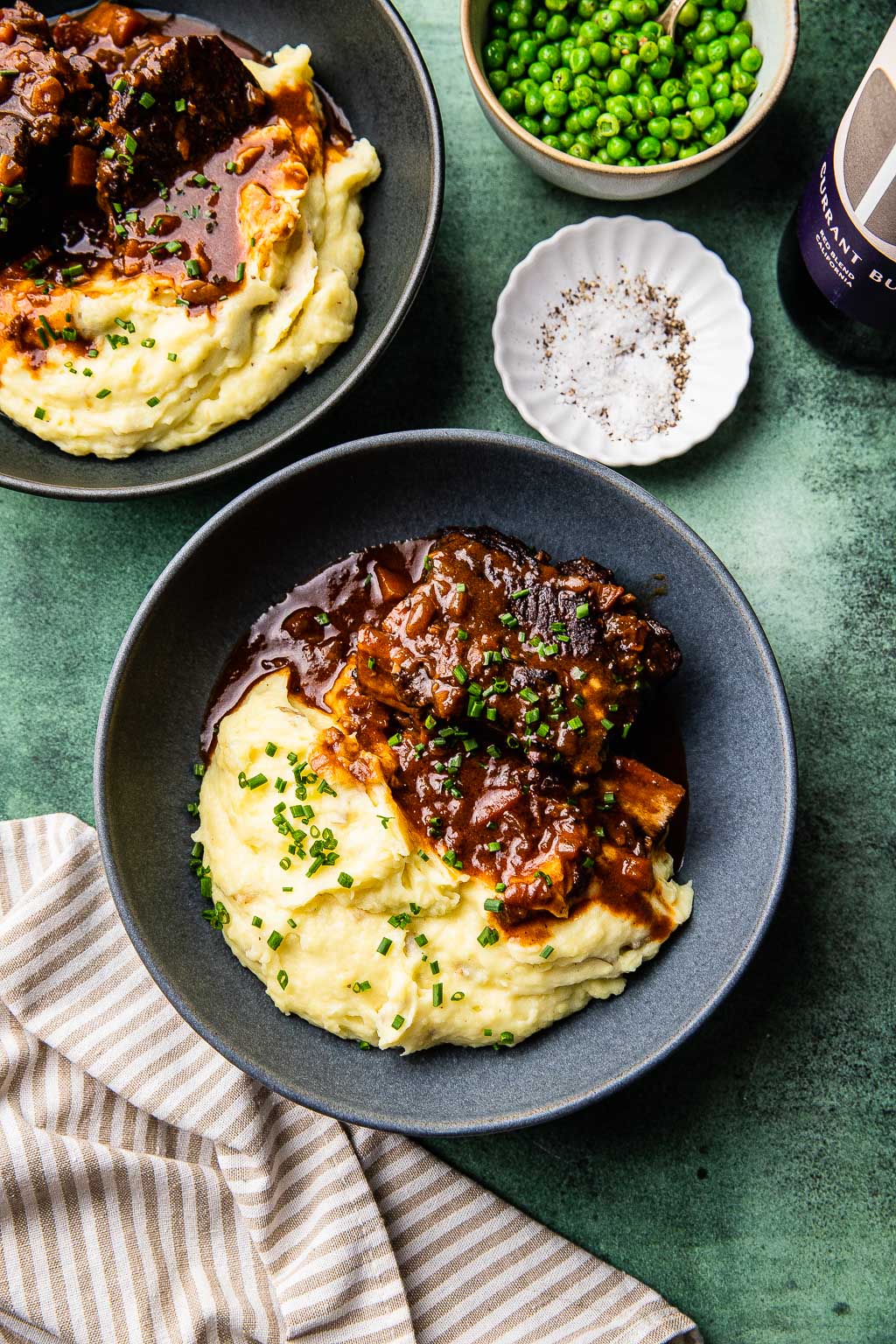 Braised short ribs in red wine sauce over a bed of mashed potatoes. 