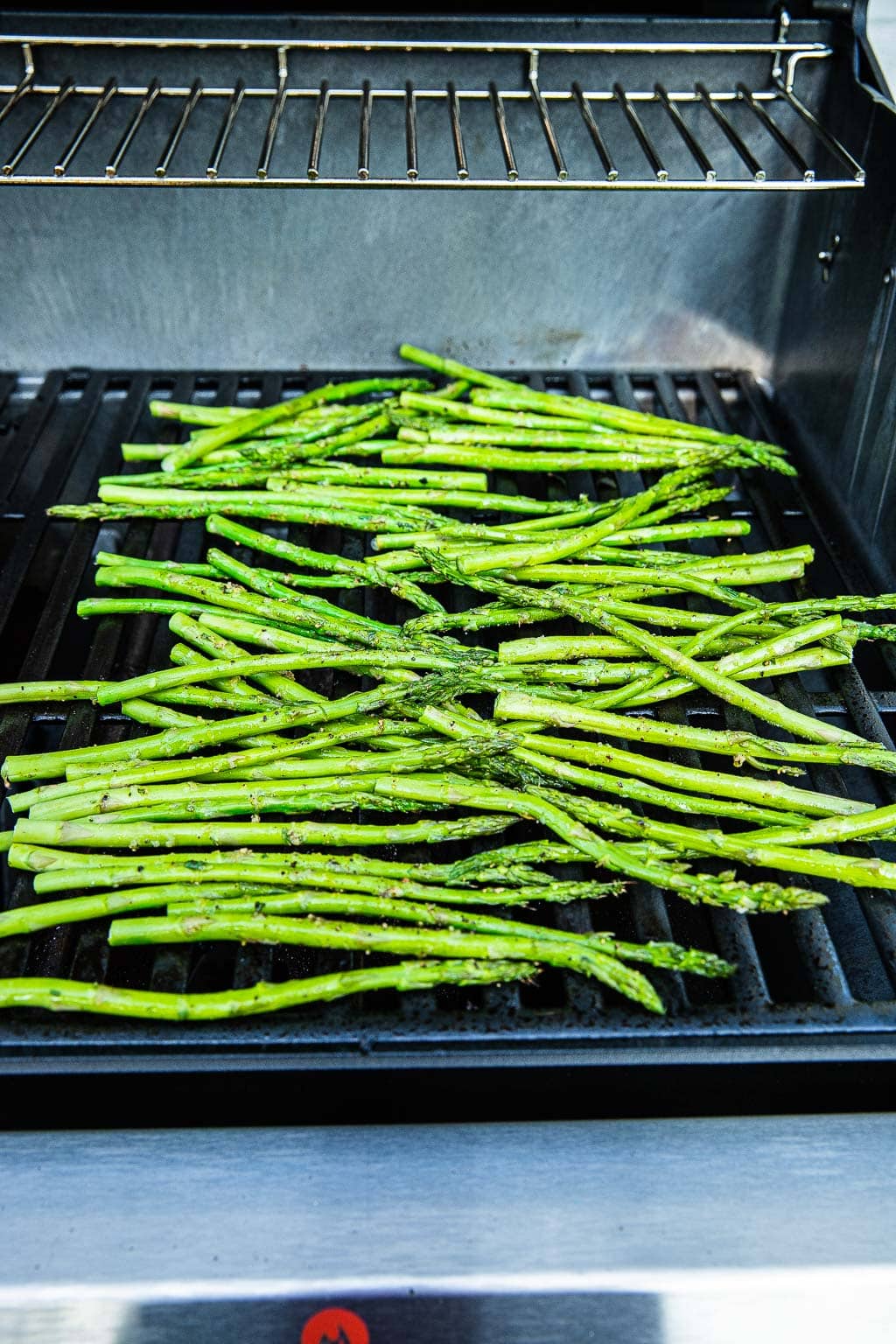 Fresh asparagus spears on a hot grill