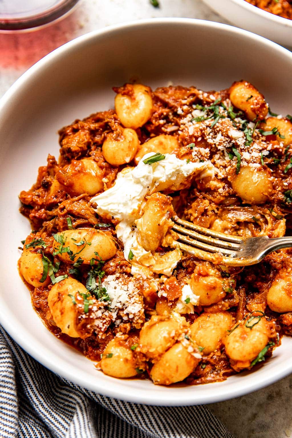 braised beef ragu served over gnocchi with a dollop of mascarpone 
