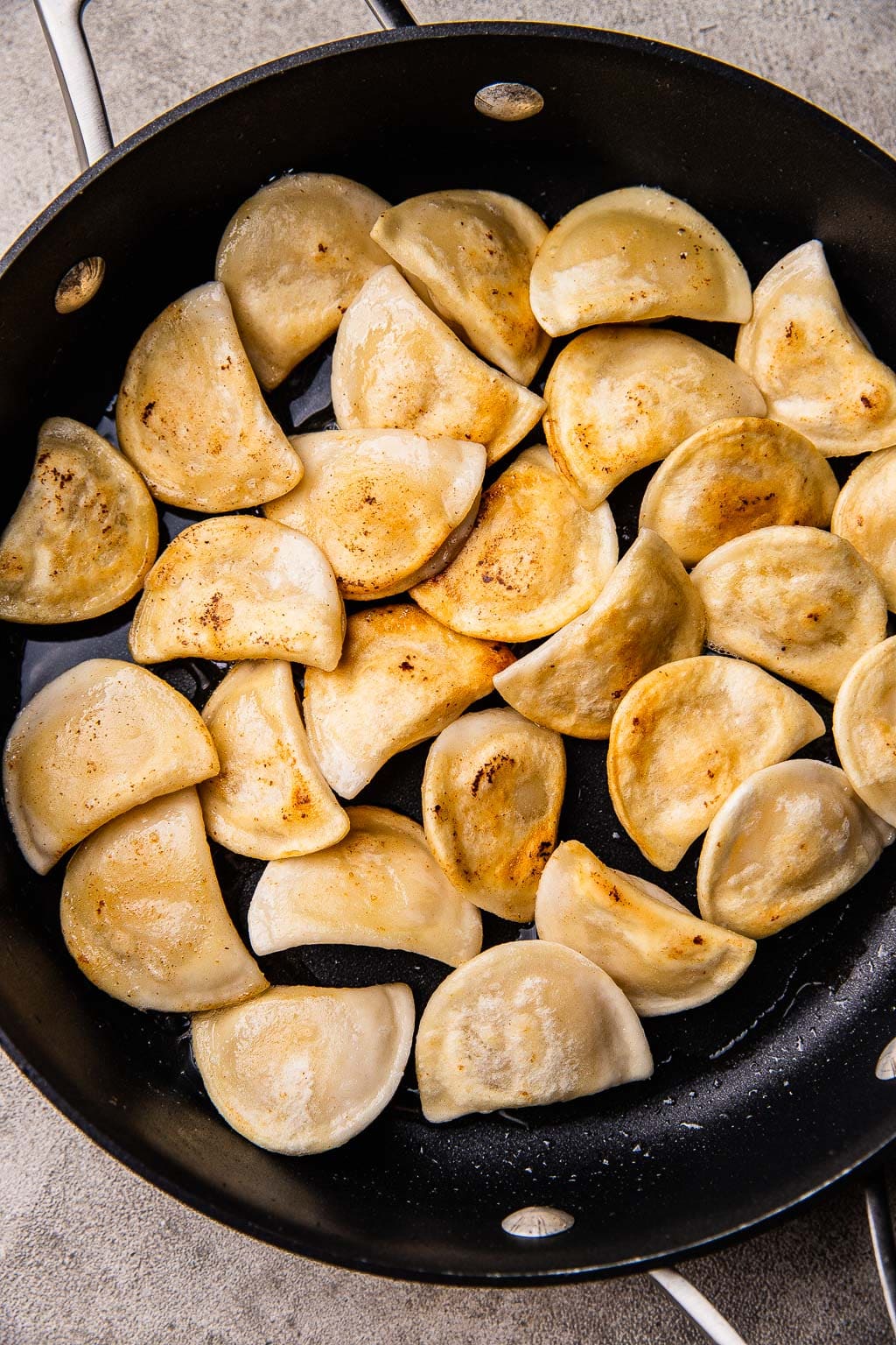 Pierogies browning in large skillet 