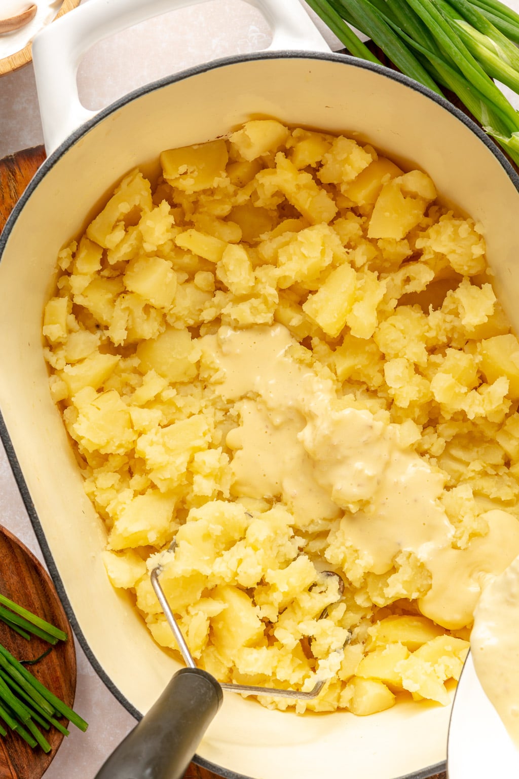 Potatoes being mashed 