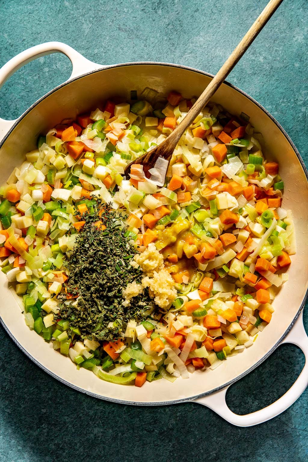 Sauteed vegetables and aromatics in a skillet 