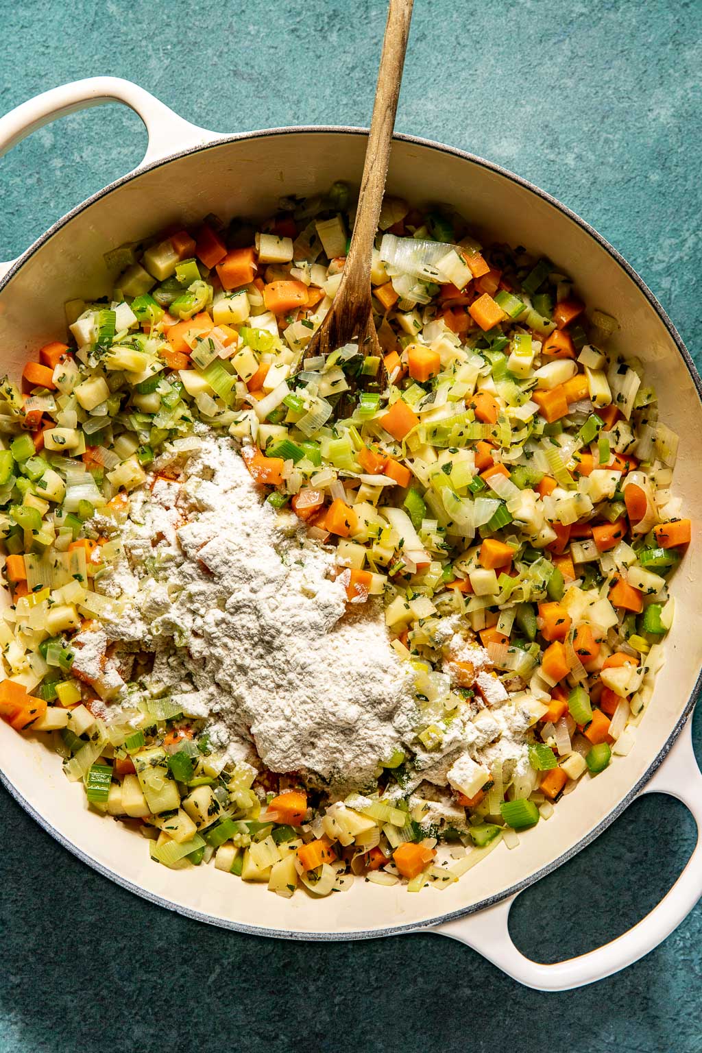 Flour sprinkled over sauteed vegetables 