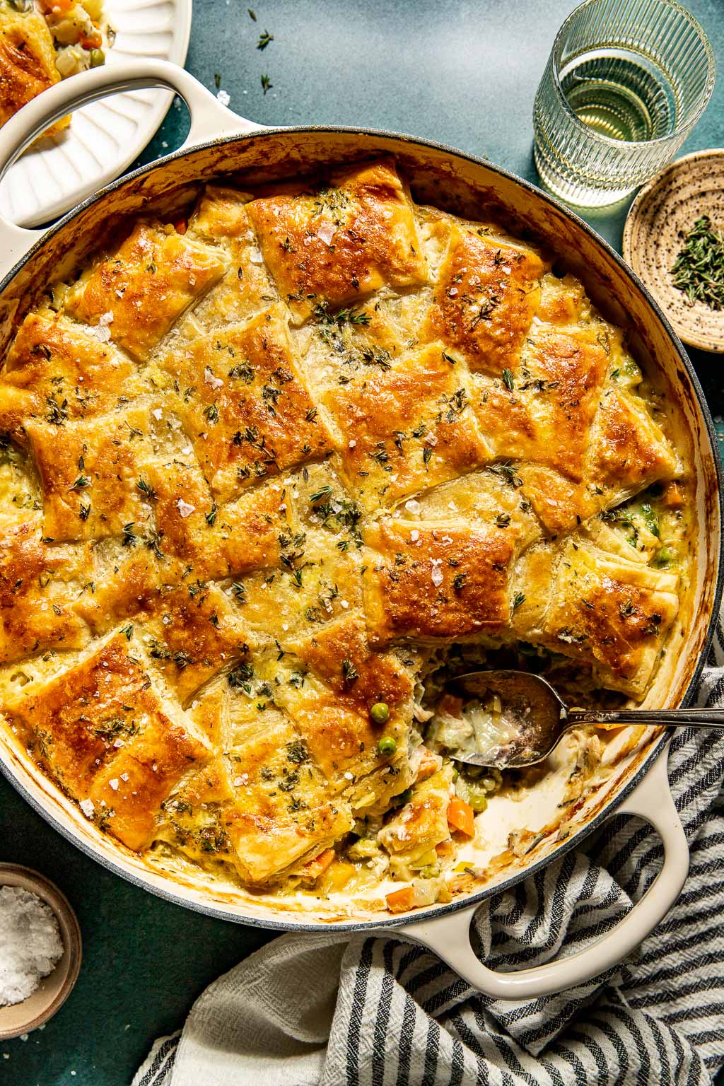 Puff pastry topped chicken pot pie in a skillet 