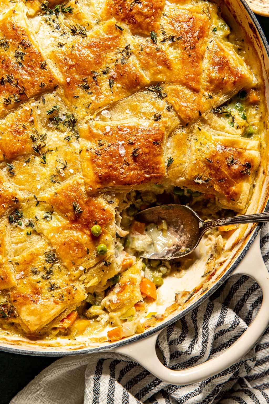 Puff pastry topped chicken pot pie in a skillet 