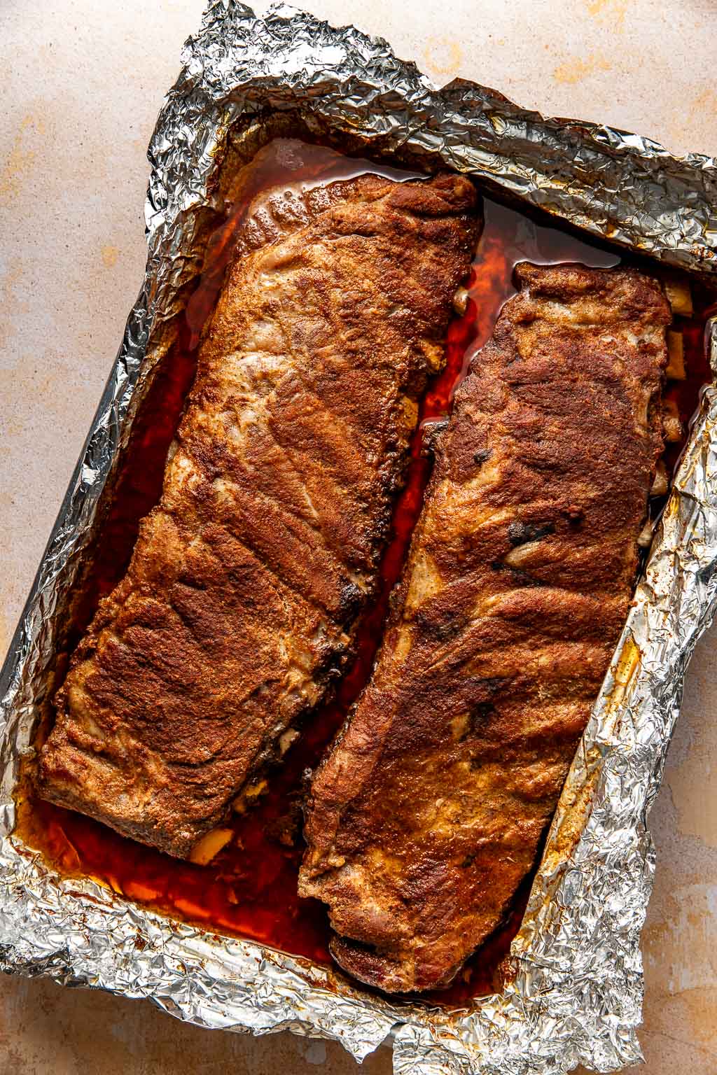 ribs on a baking sheet after coming out of the oven