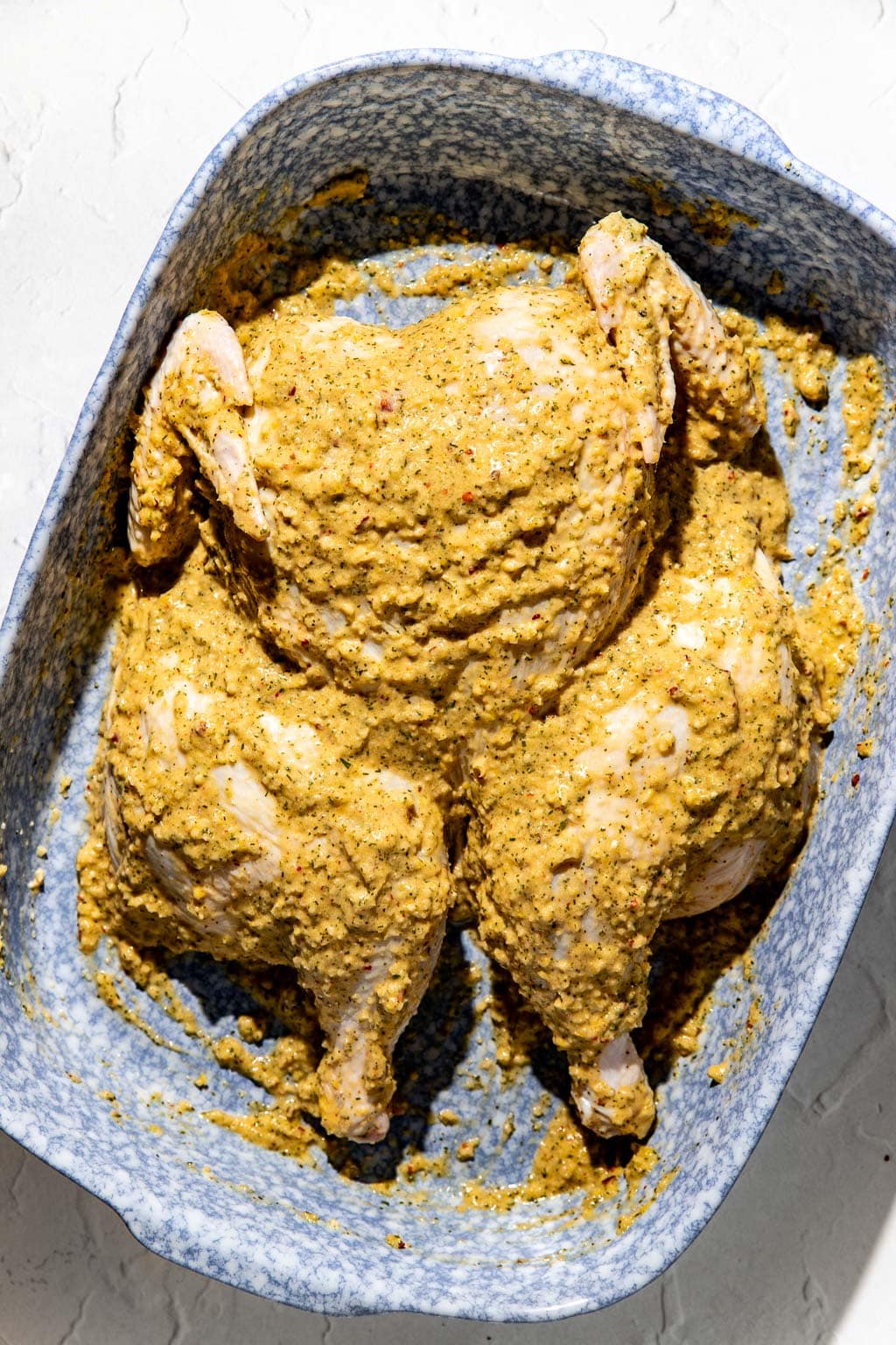 chicken, after massaging marinade into the skin