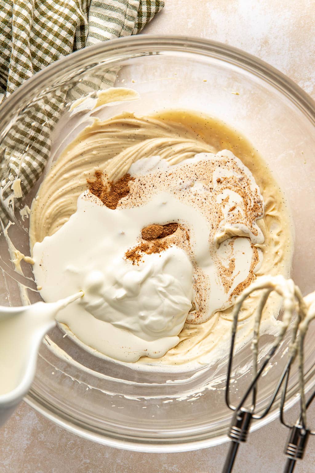 Ingredients for stabilized whipped cream in a mixing bowl. 