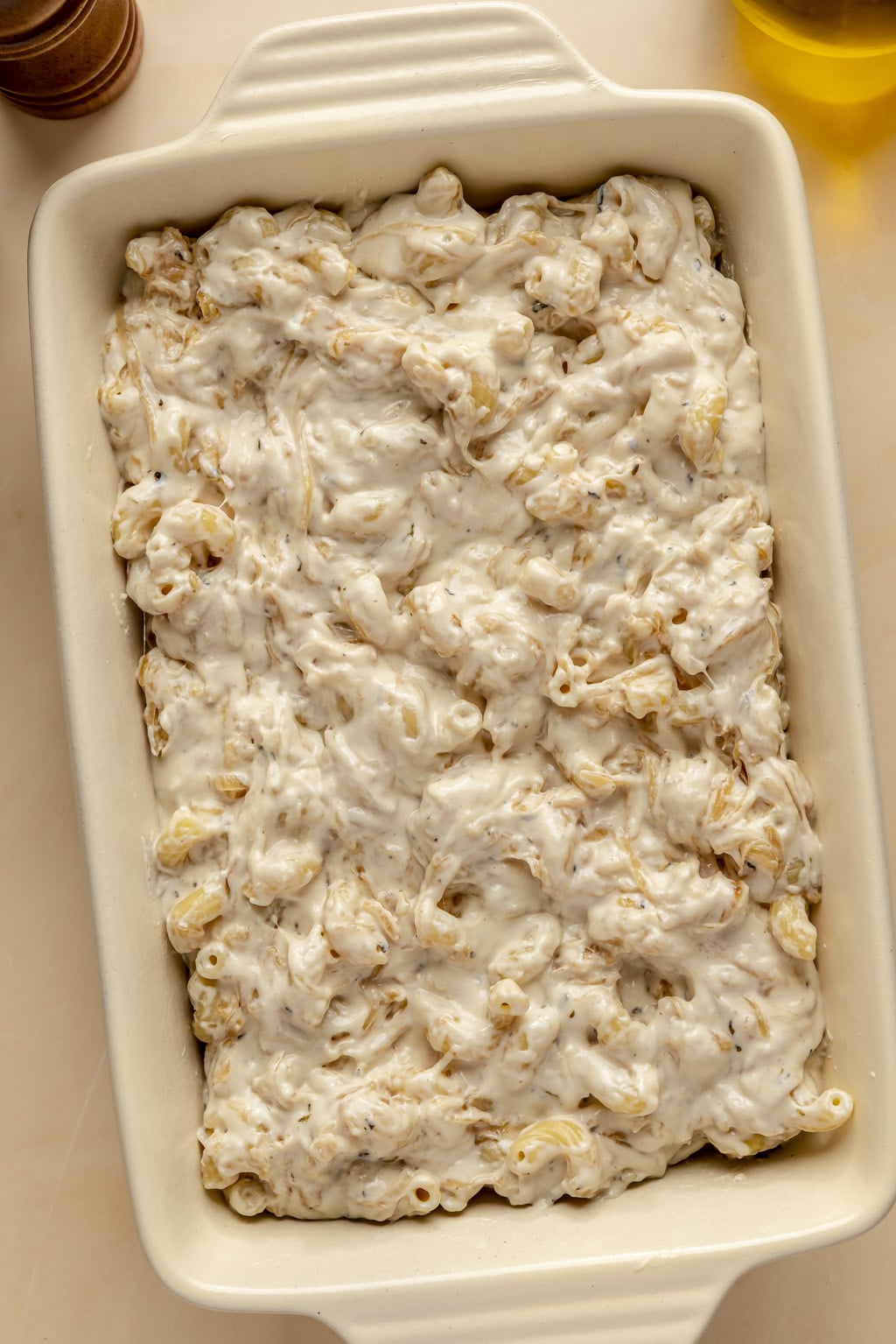 Mac and cheese in a baking dish, ready to be baked. 