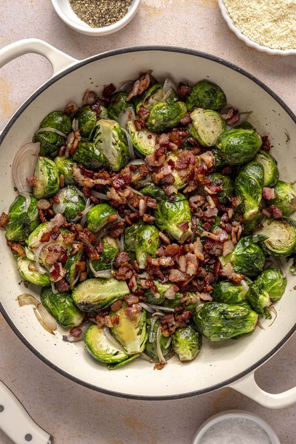Brussels sprouts, bacon, and shallots in a Dutch oven. 