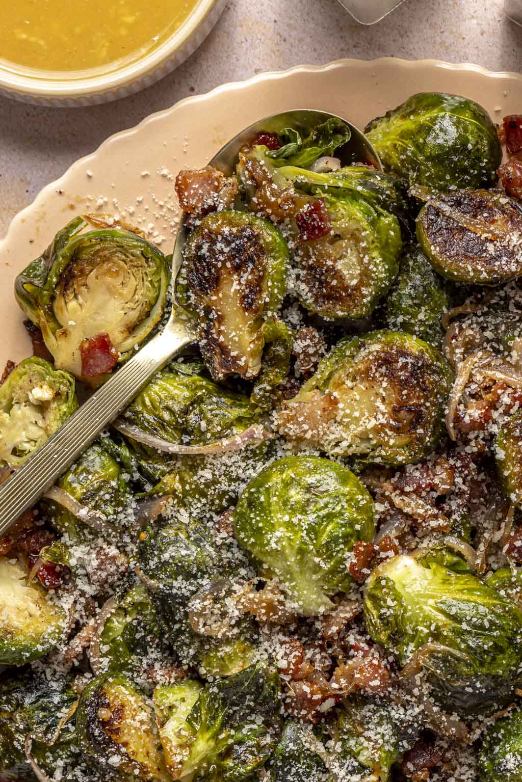 crispy miso honey glazed brussels sprouts on a platter.
