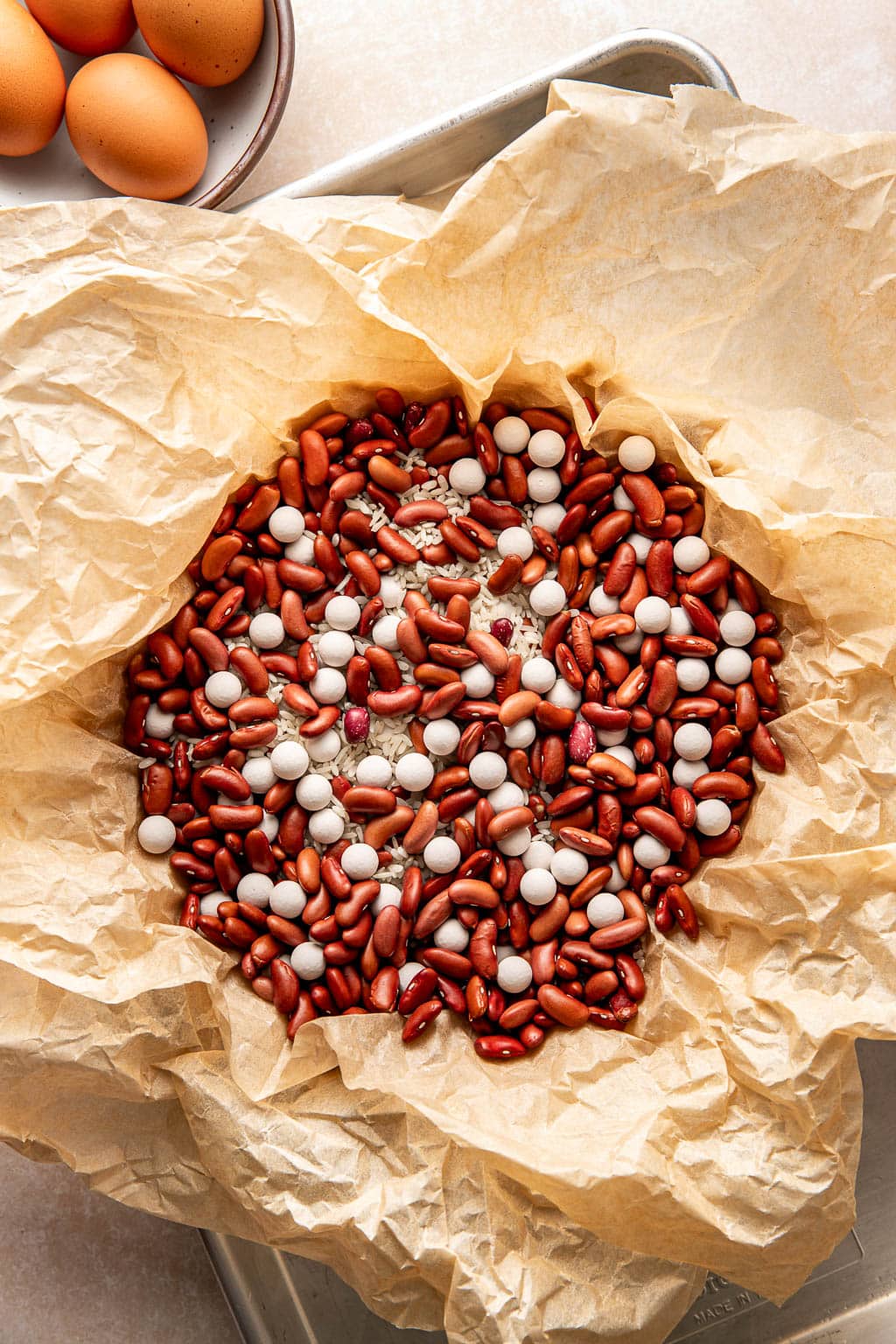 pie weights sitting in the unbaked crust