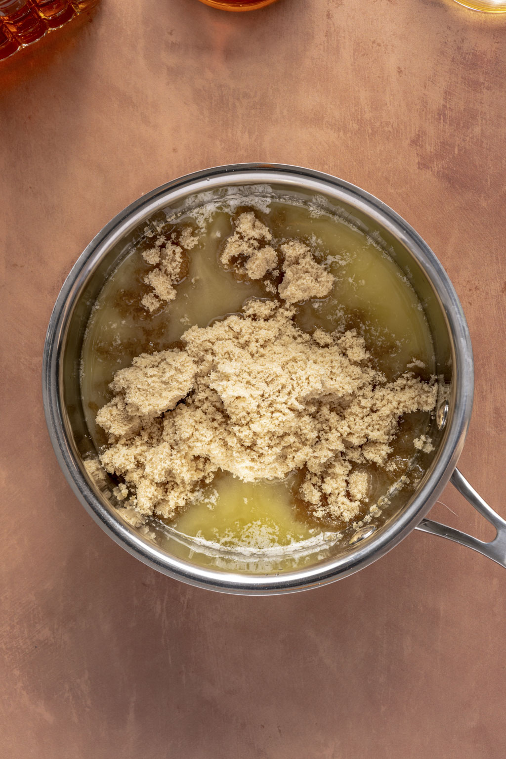brown sugar and butter in a stainless steel saucepan