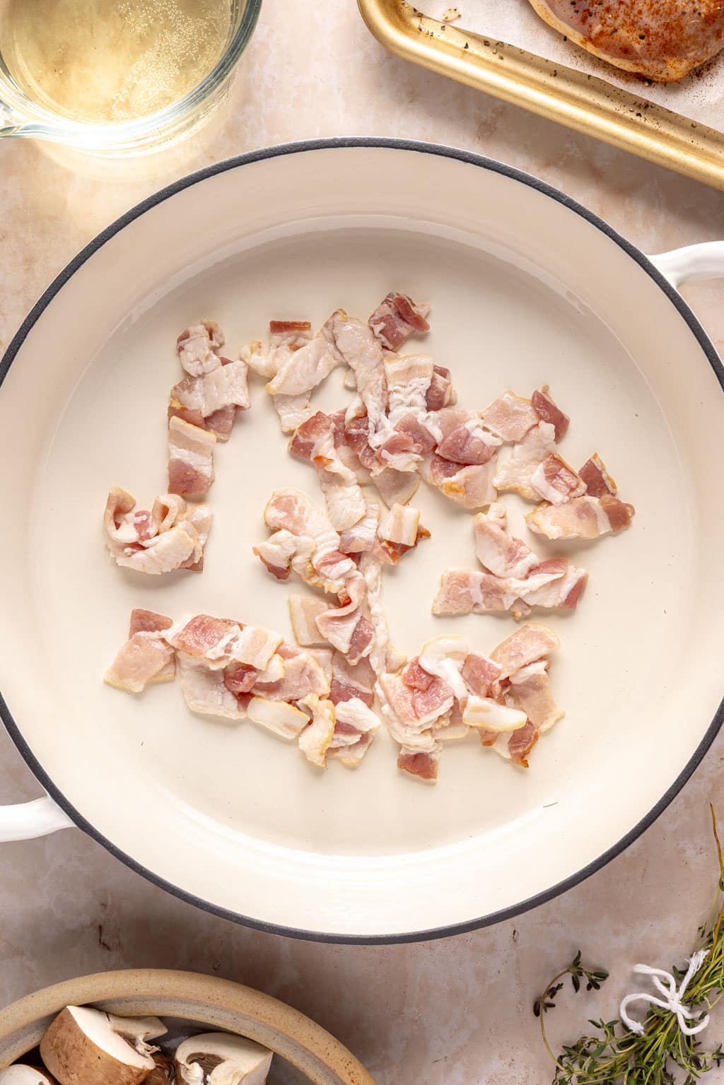 bacon in a large pan before cooking