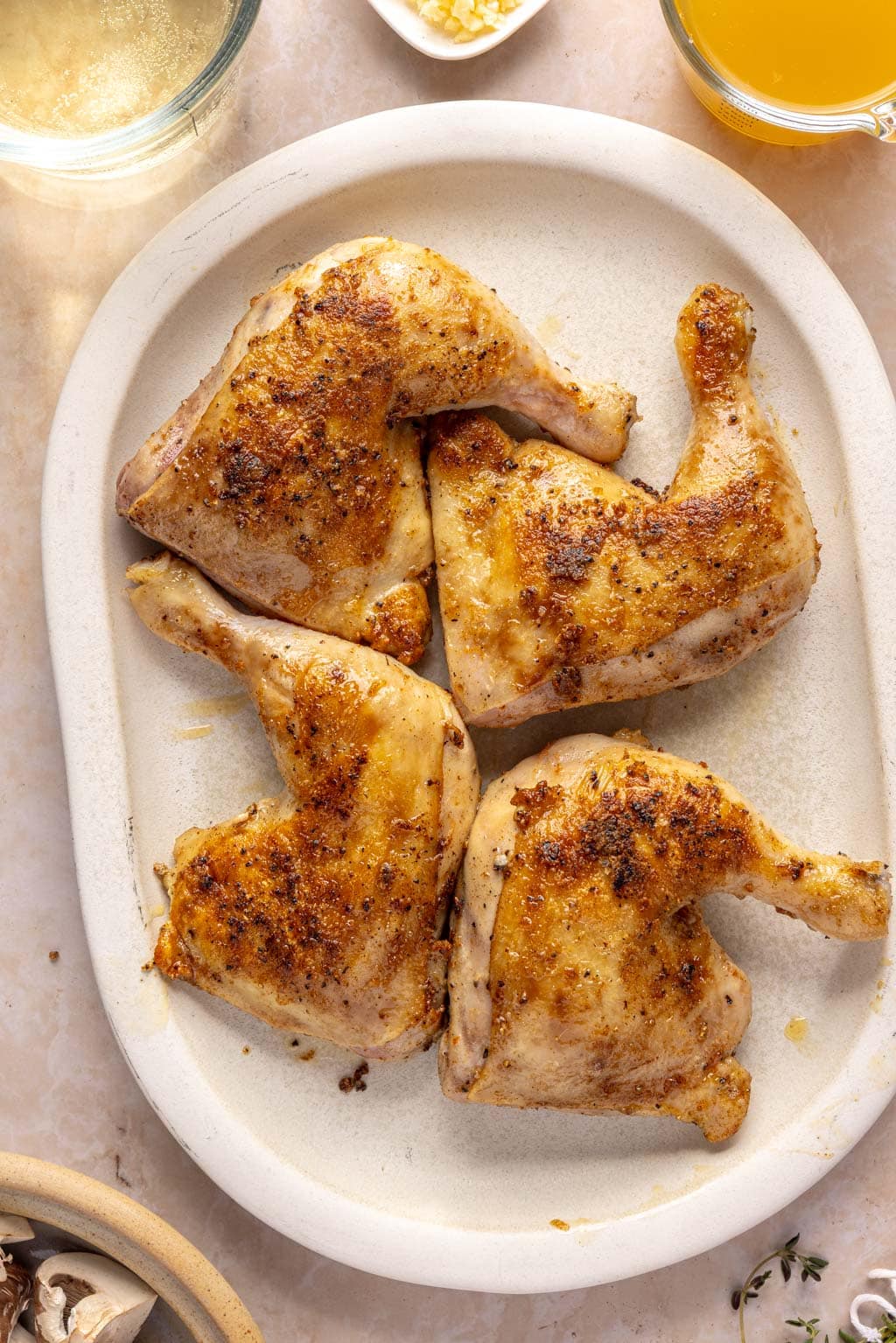 seared chicken leg quarters on a plate
