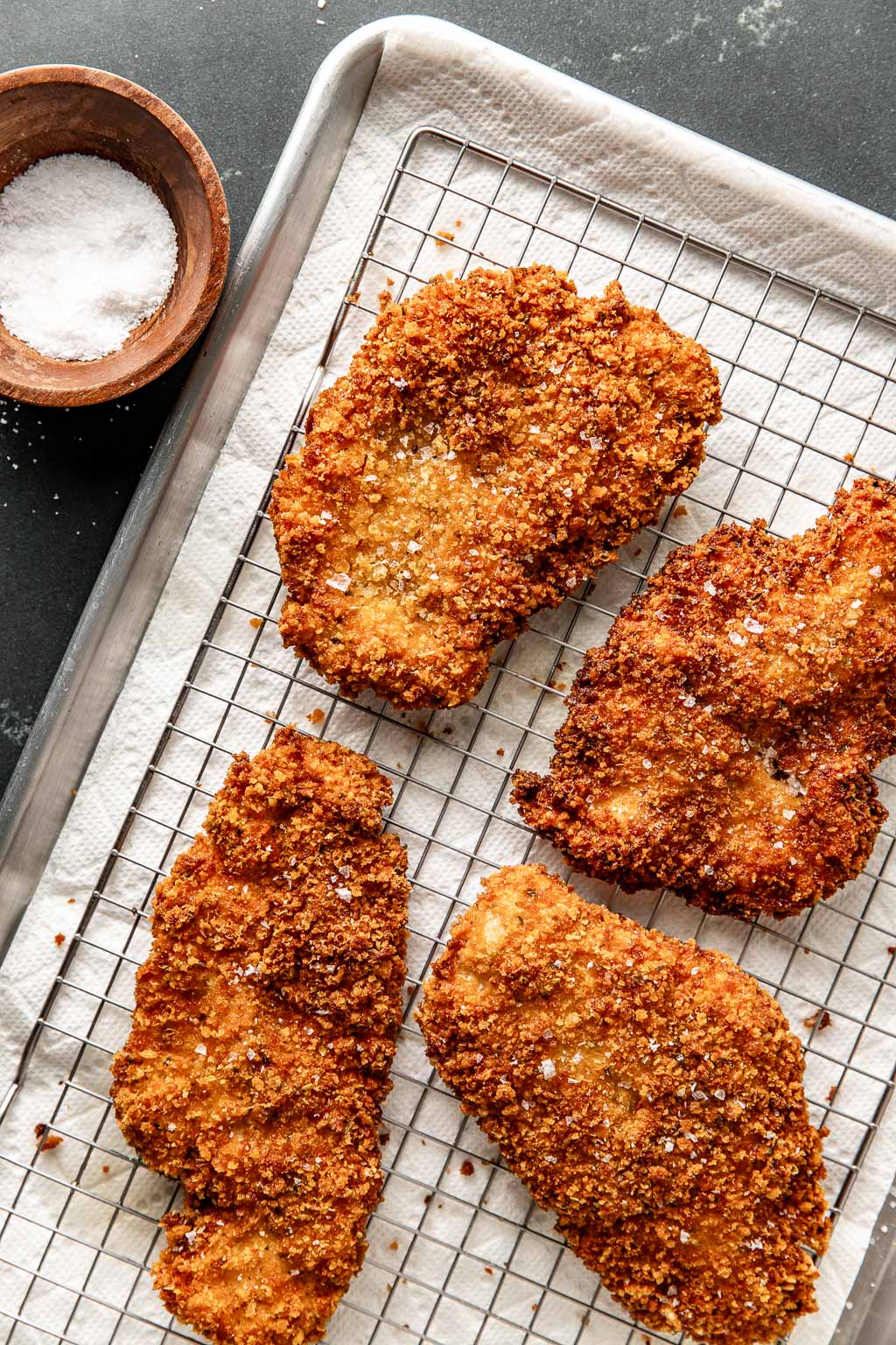 fried chicken cutlets on a baking sheet