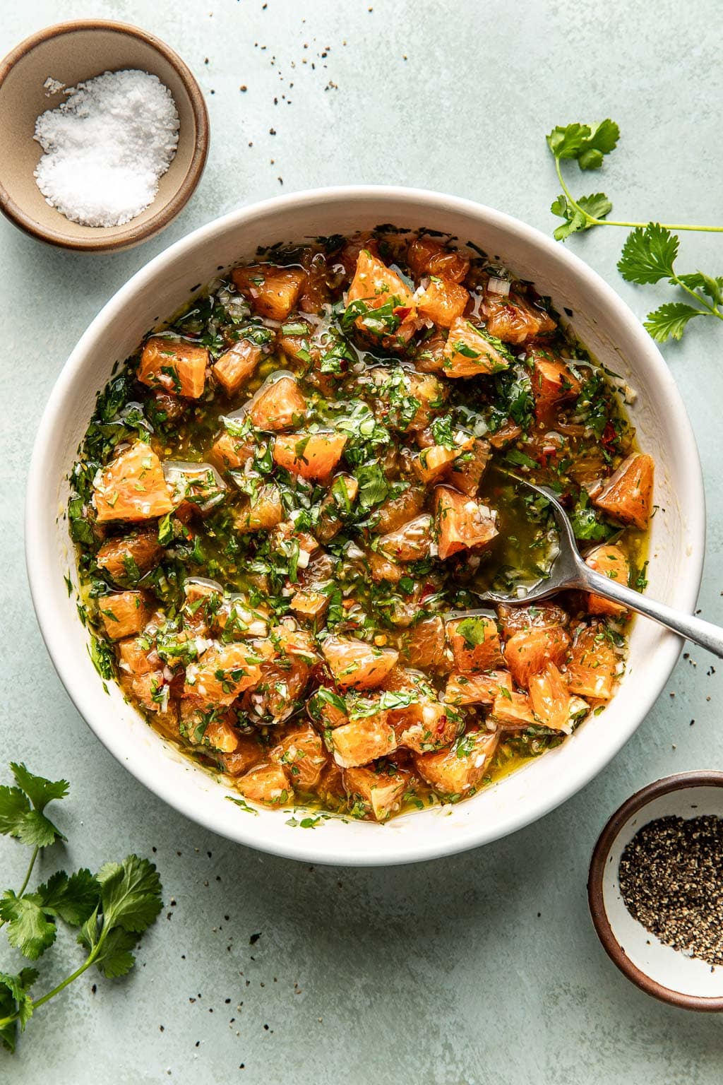 orange chimichurri salsa in a mixing bowl 