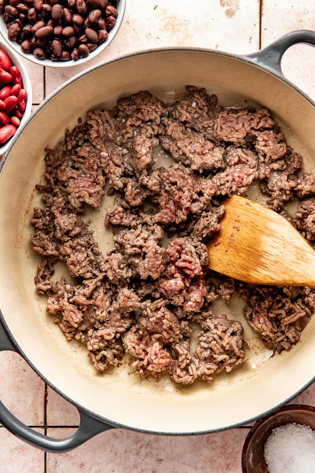 ground beef cooking in a dutch oven