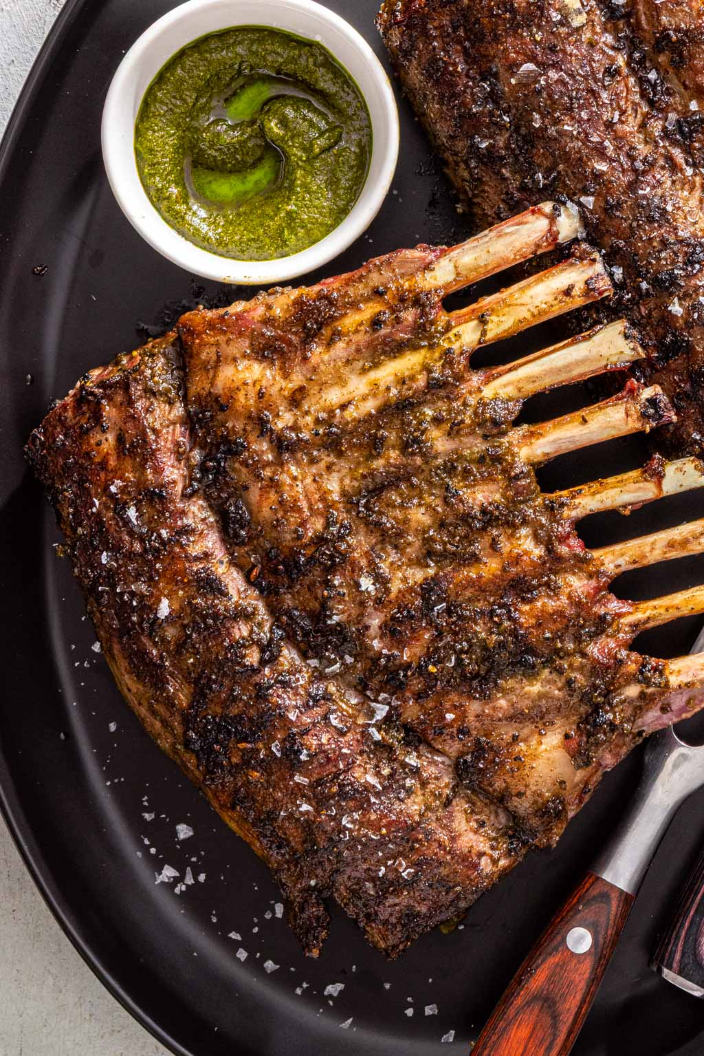 grilled rack of lamb on a serving platter
