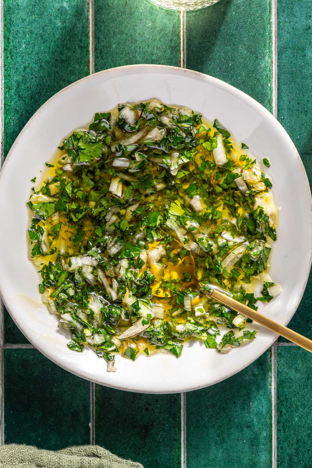 gremolata in a small white bowl after mixing