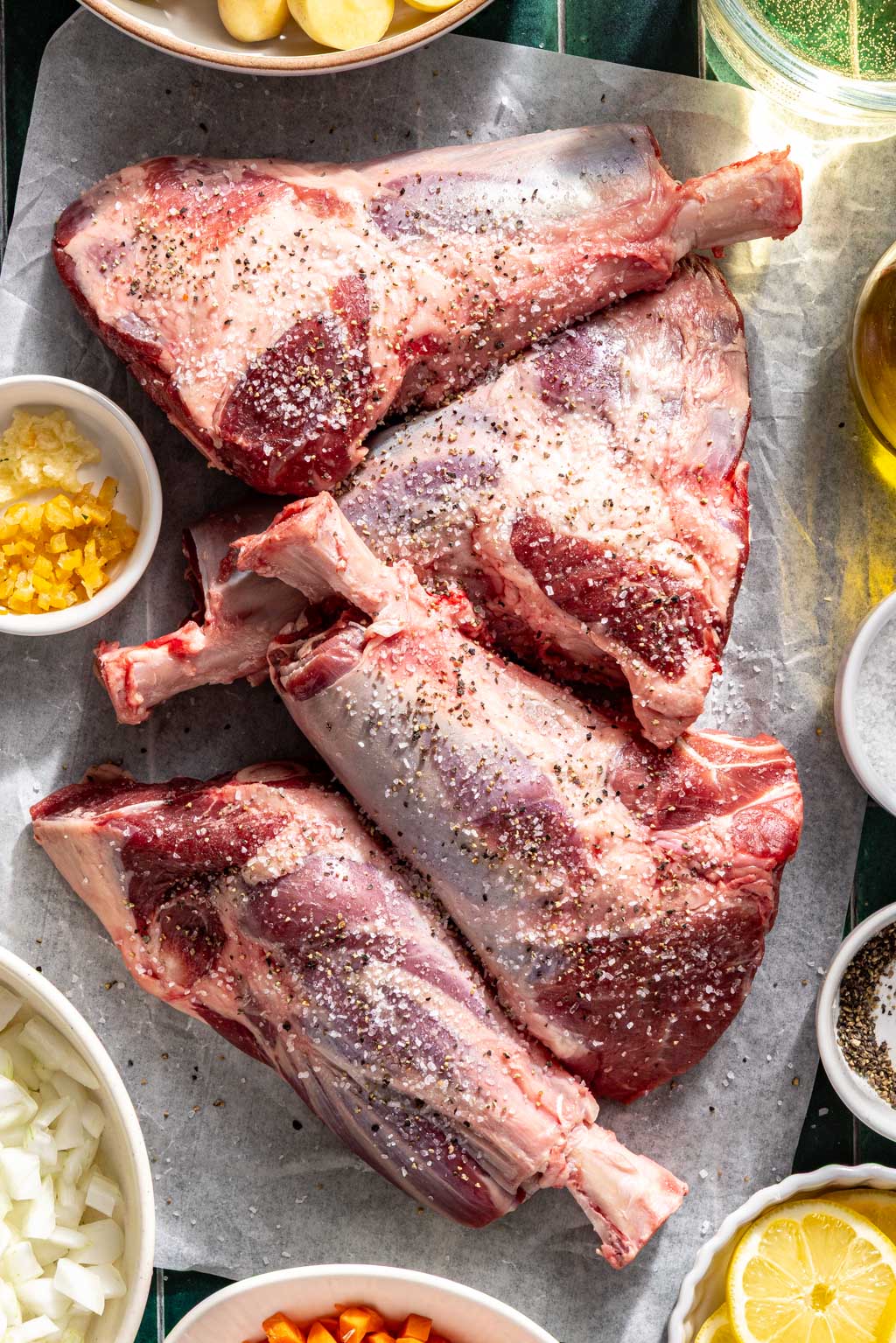 Seasoned lamb shanks before cooking