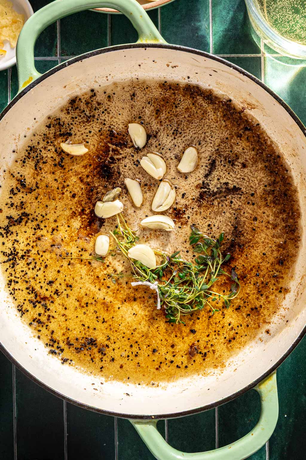 Garlic, herbs, and olive oil in a dutch oven