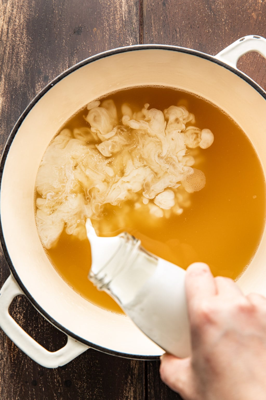 Cream and chicken stock in a dutch oven