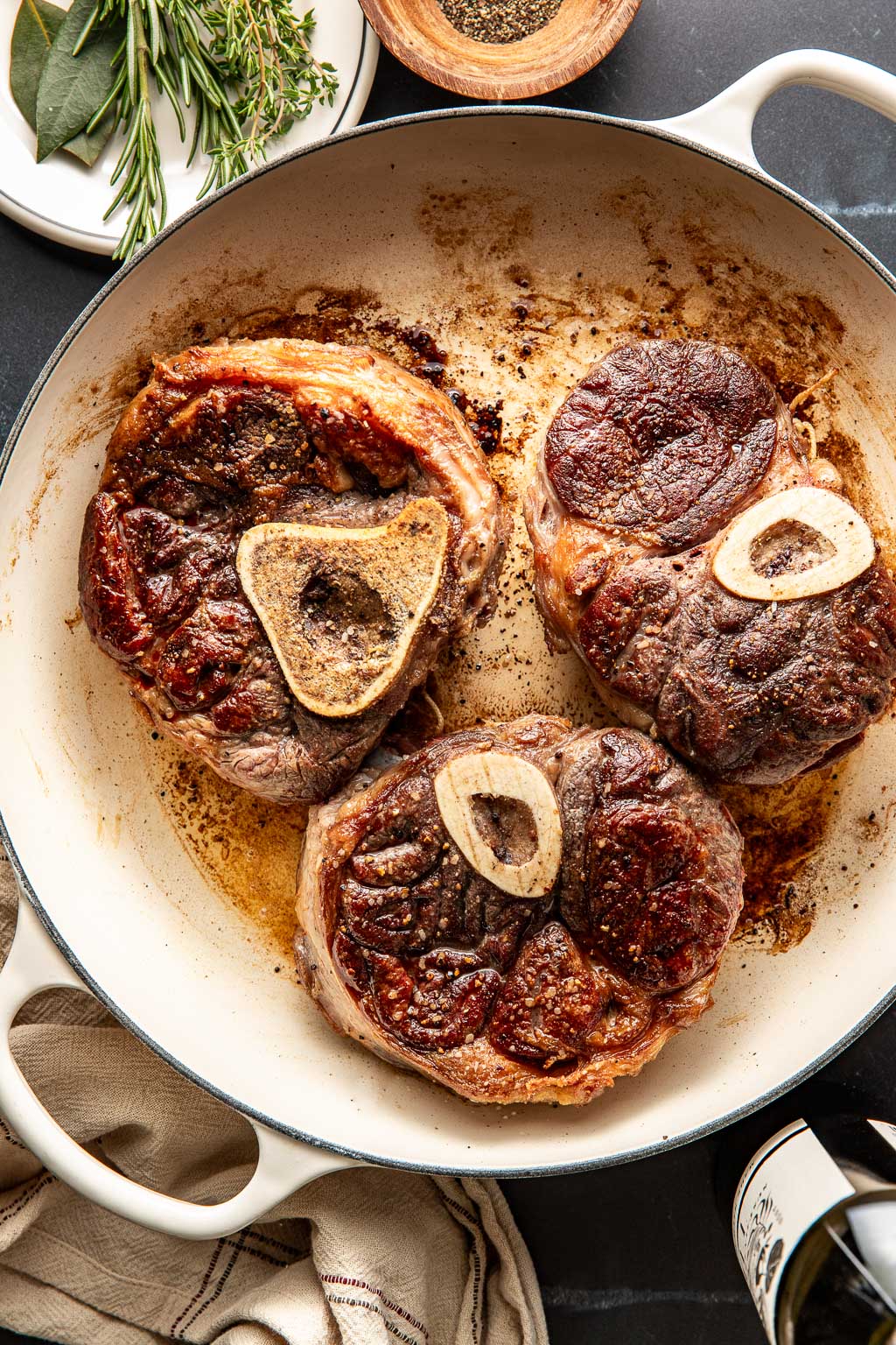 Seared beef shanks in a braiser